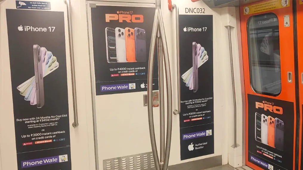 iPhone launch branding on metro coach interior door panels