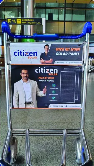 Citizen Solar branding on airport baggage trolleys in the departures hall