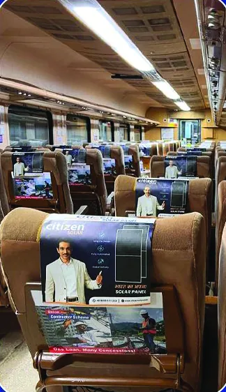 Citizen Solar branding on train seat-back tray tables