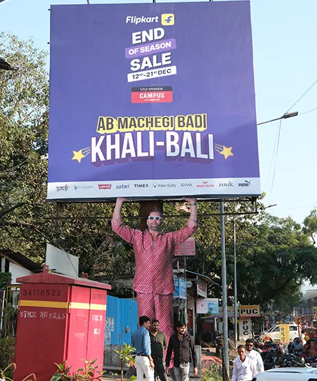 Flipkart End of Season Sale hoarding with a three-dimensional cut-out hanging from the frame