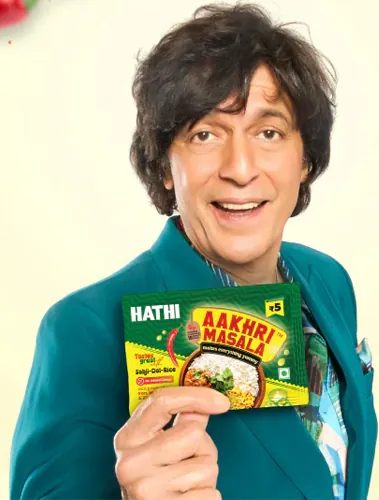 Hathi Aakhri Masala campaign creative with the celebrity holding the five rupee sachet