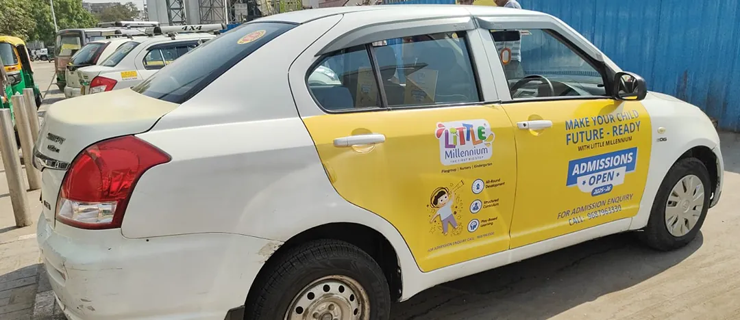 Little Millennium cab branding on the roads around the centre