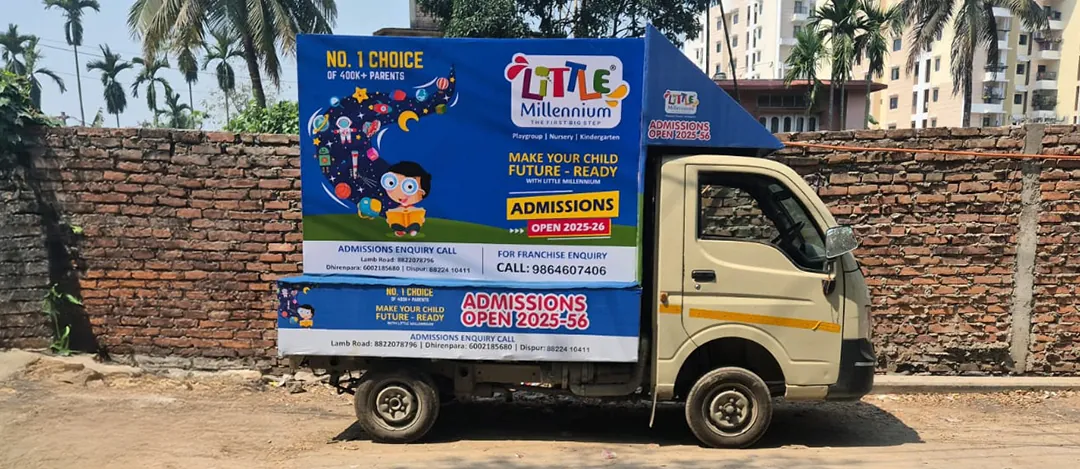 Little Millennium mini truck branding photographed on a Guwahati street