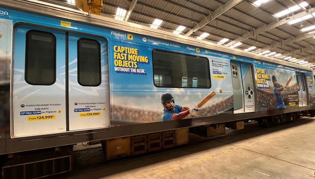 Full Motorola Edge 70 Fusion train wrap photographed in the depot