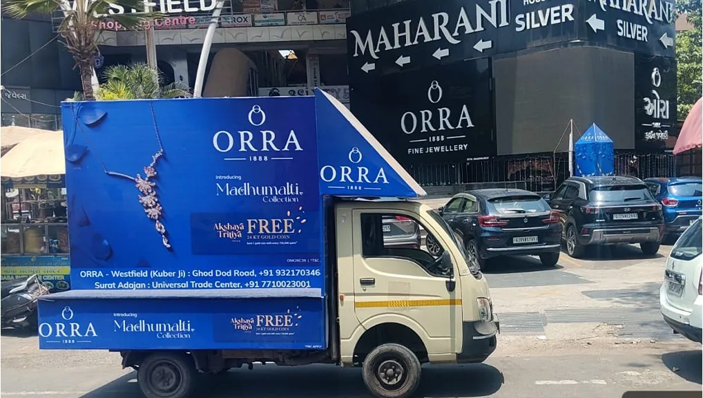 ORRA branded van parked outside the Surat showroom carrying the Madhumalti collection