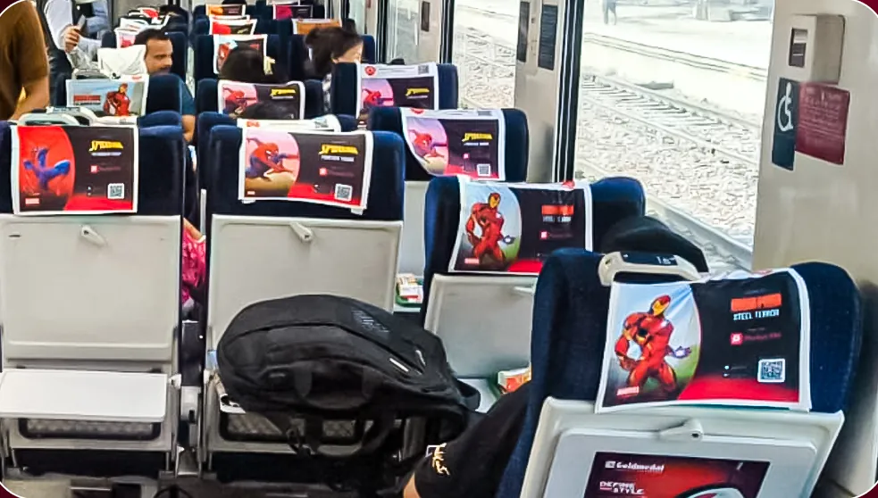 Pocket FM headrest branding running down a full train coach