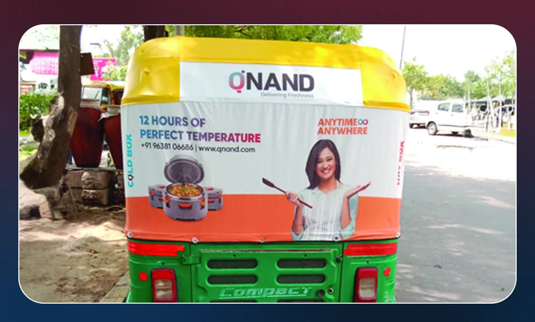 Qnand auto-rickshaw hood branding carrying the twelve hour temperature claim