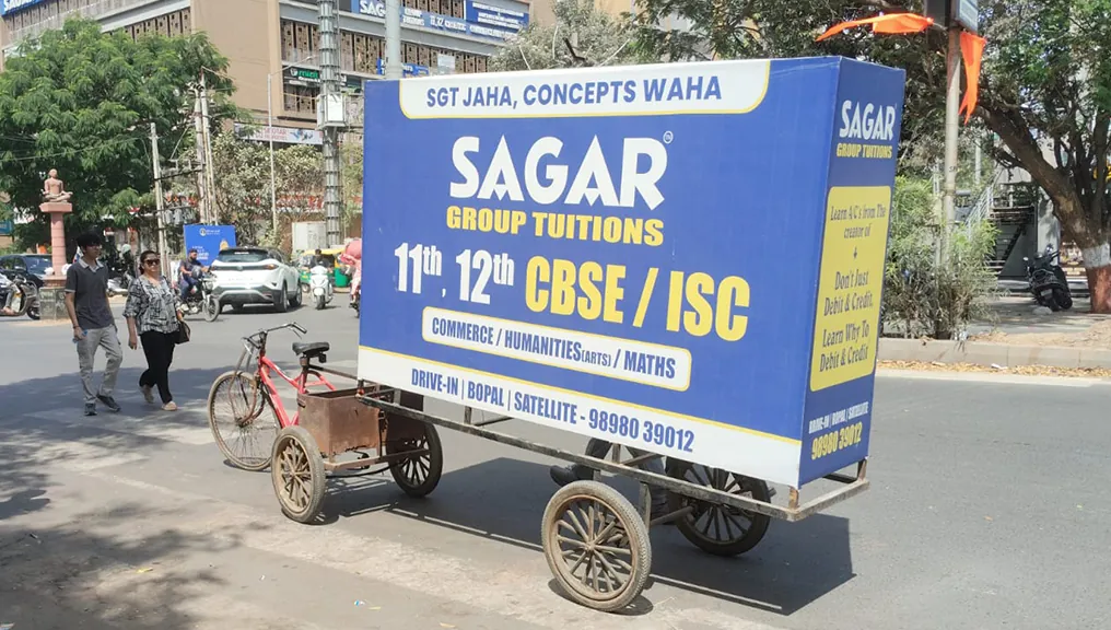 Coaching institute cart branding parked in the Bopal and Satellite tuition belt, Ahmedabad