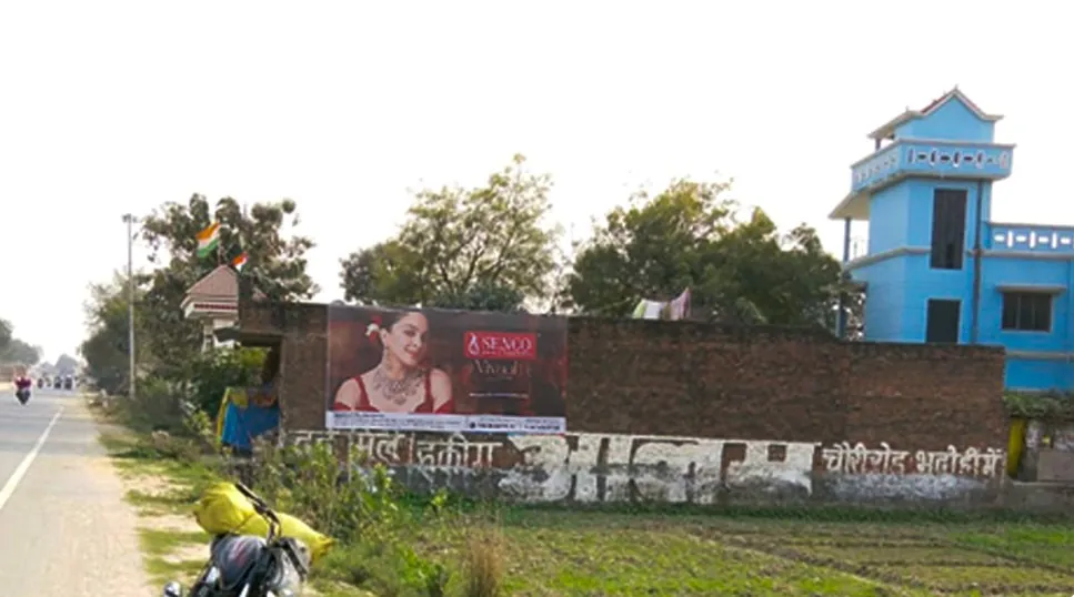 Senco Vivaah collection hoarding mounted on a boundary wall along a village highway