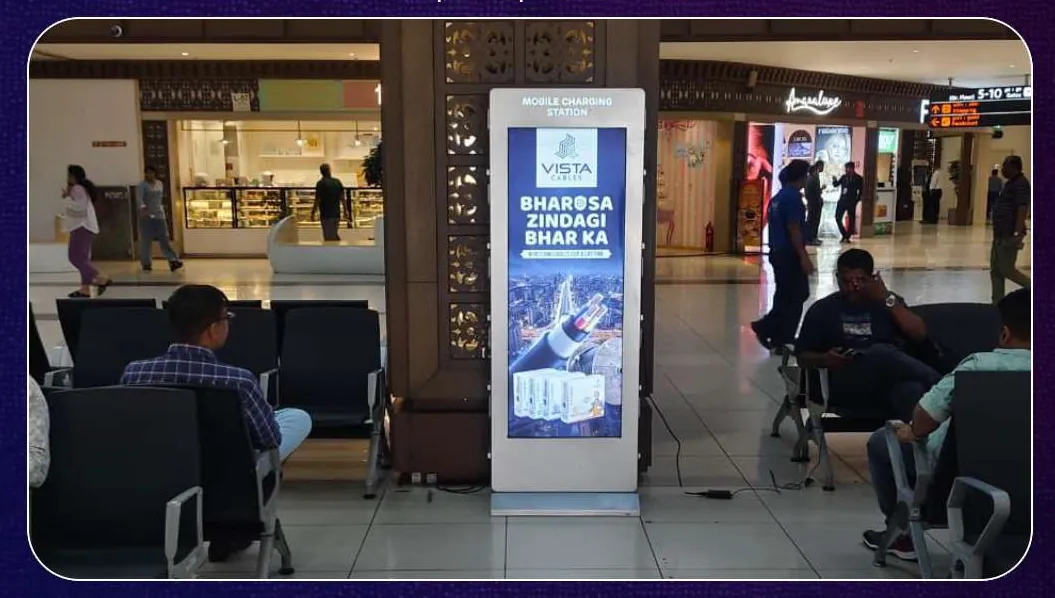 Vista Cables branded mobile charging station in a mall concourse beside the seating